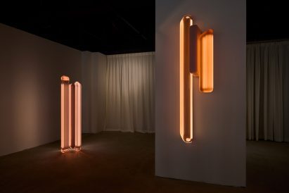 two glowing floor lamps 
