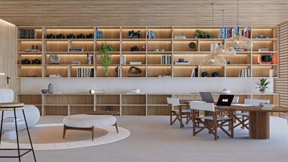 A visualisation of an interior space in tones of grey and beige. There is a large wooden shelving unit against the central wall, and a brown wooden desk along with chairs and a footstool in the space.