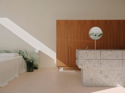 Stone headboard by Pattern Studio