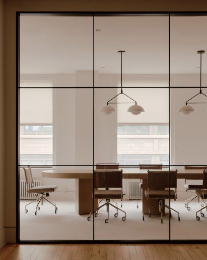 Conference room visible through large glass panels