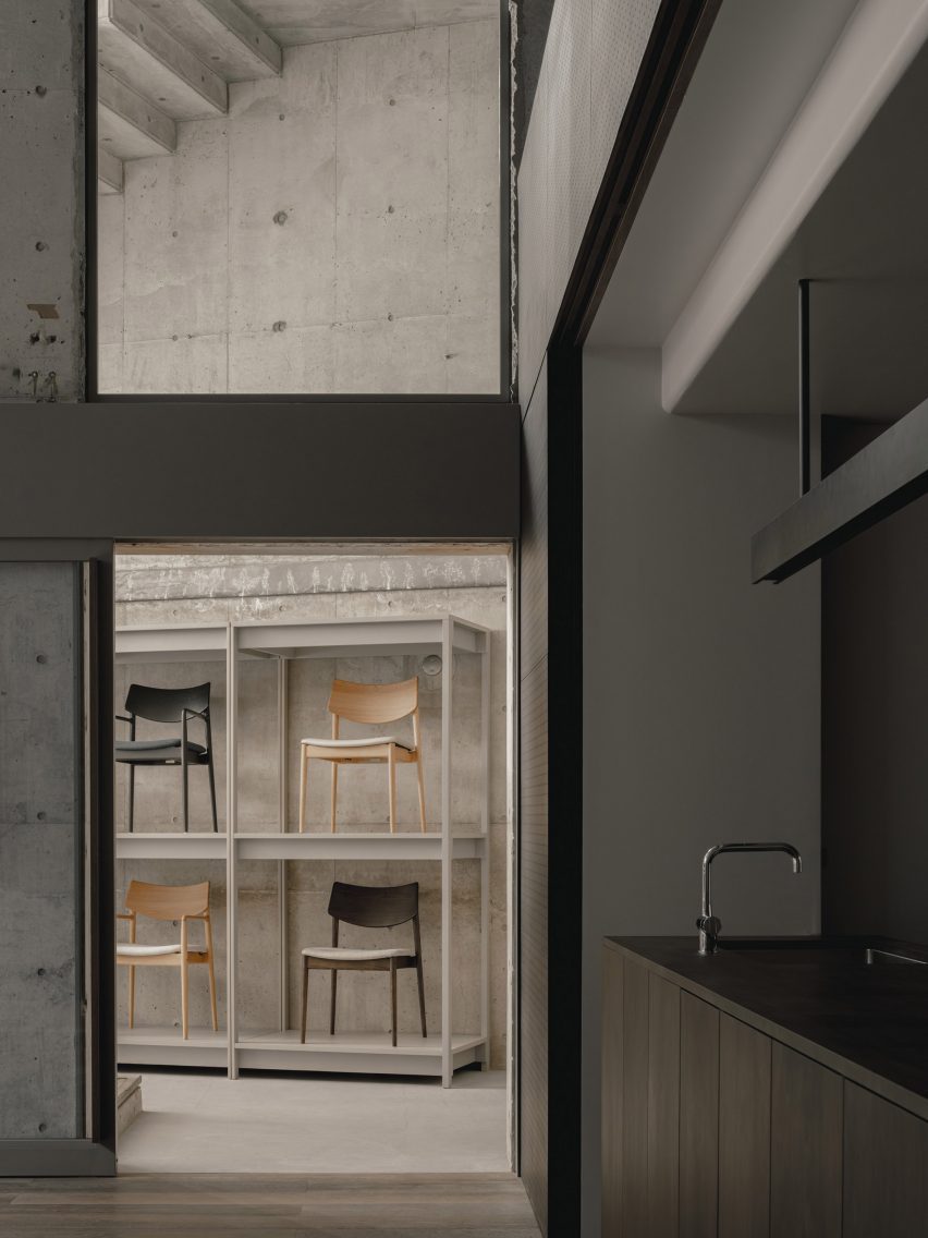 Kitchenette area with doorway looking onto chairs on display