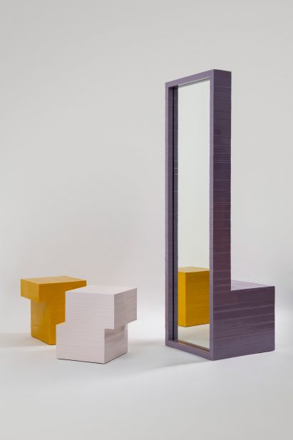 Chair with a tall backrest that doubles as a mirror