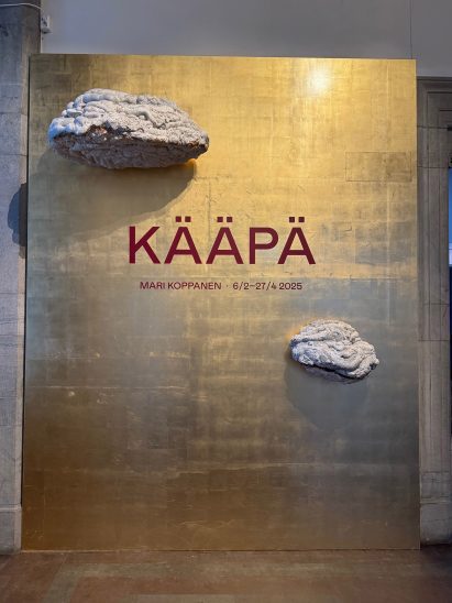Bronze panel featuring two fungus like growths
