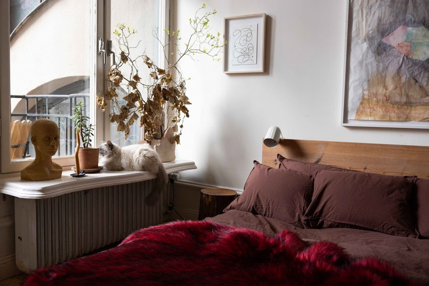 Bedroom with red throw