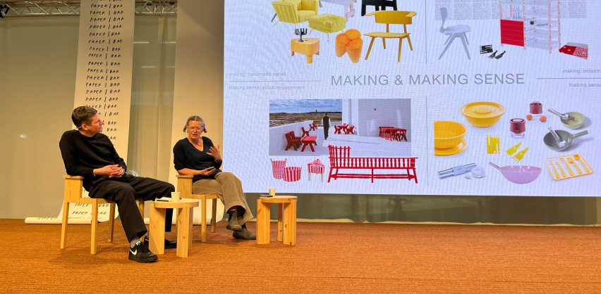 two people sat on stage