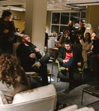 people gathered in a furniture showroom
