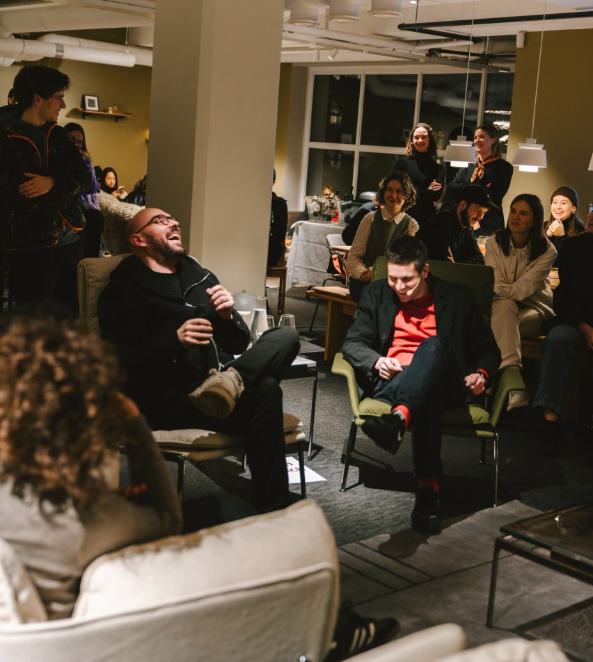 people gathered in a furniture showroom
