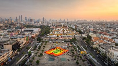Overhead shot of Bangkok with a colourful woven mat taking over a square