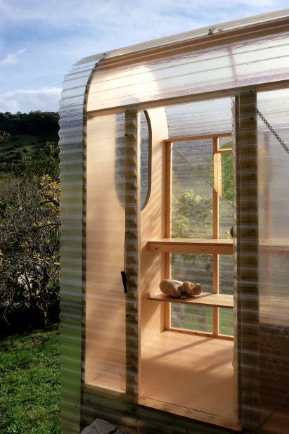 View inside outdoor toilet cubicle overlooking a valley in Spain