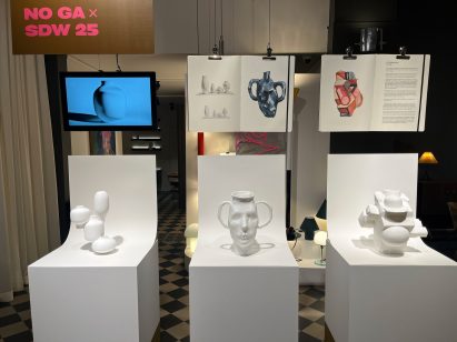 white ceramic vessels on plinths