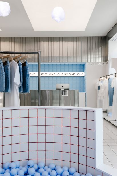 Ball pit within a minimalist clothing boutique