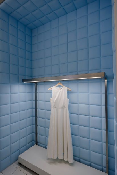 Fitting room lined with pale blue padding
