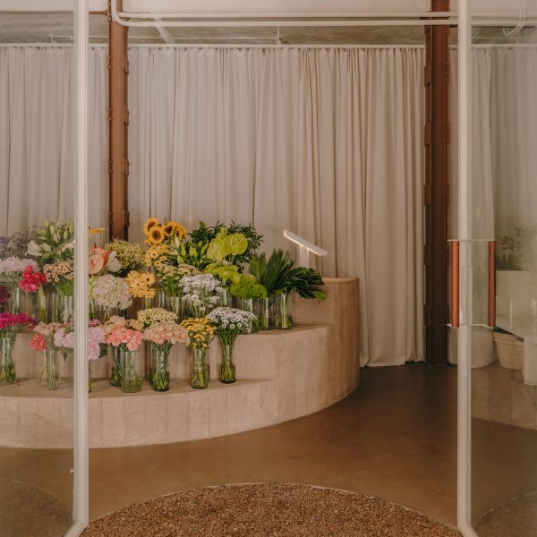 Flower shop interior with concrete display stand holding flowers