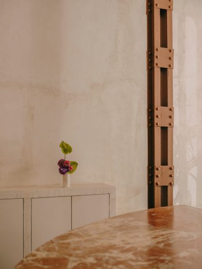 Neutral interior with vase of flowers on side
