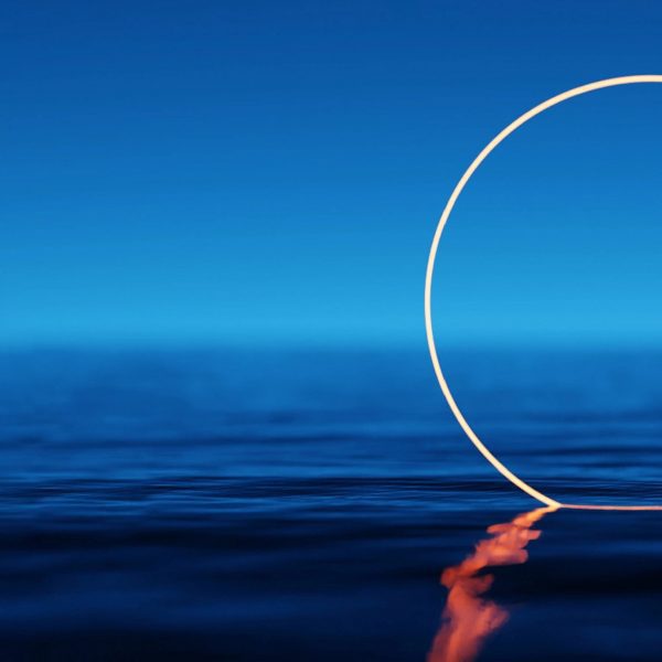 Ring of light partially submerged in water