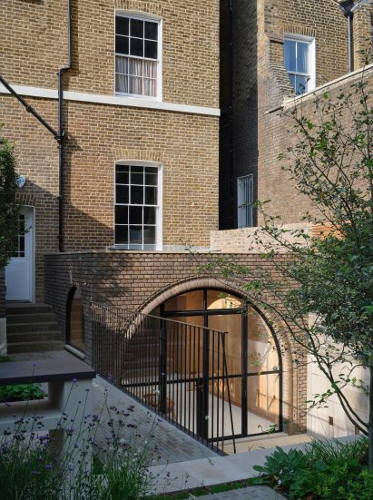 London home extension with arched doorway