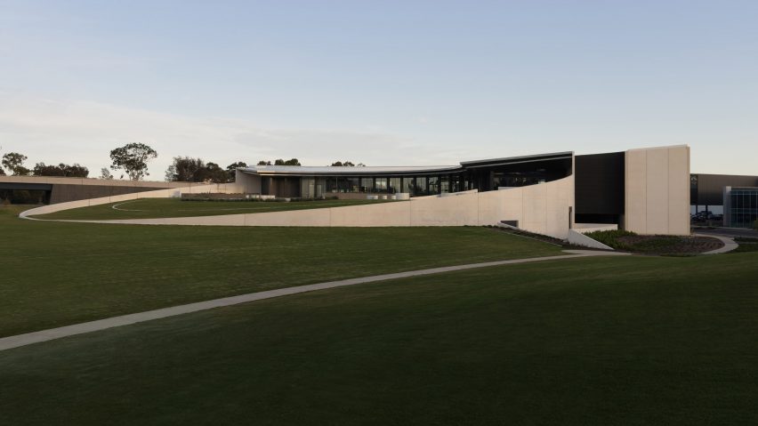 low lying concrete structure with green lawn