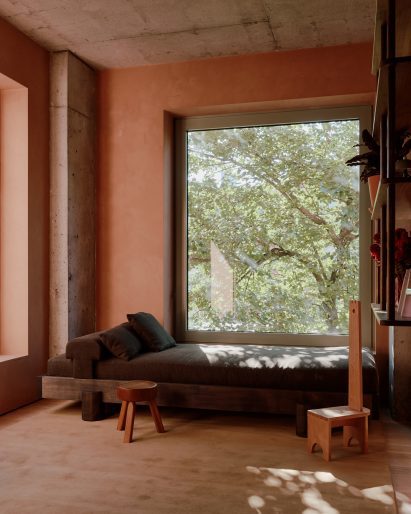 Bedroom featuring a daybed under an oversized window