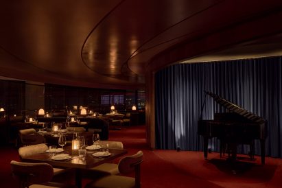 Restaurant dining area with a small piano stage