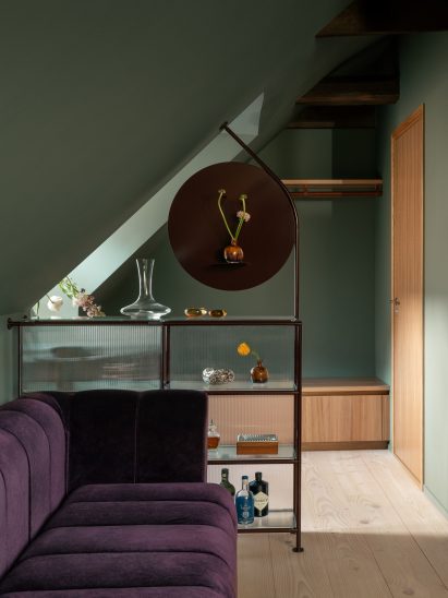 Sculptural shelf and flower vase in Stockholm dining space