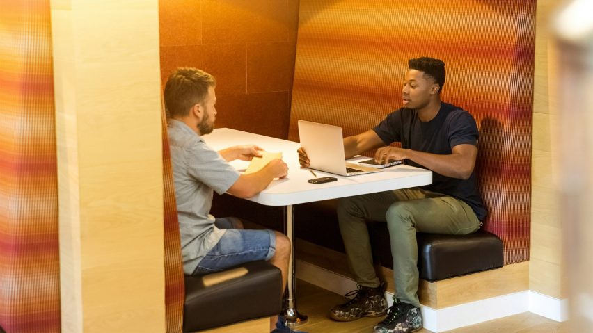 Two young men working in an office