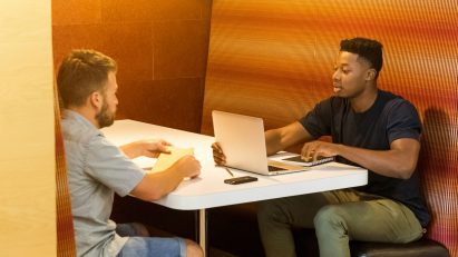 Two young men working in an office