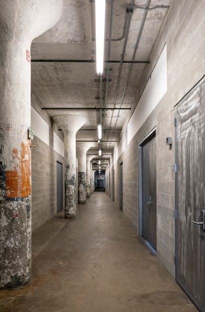 Hallway with cinder block walls