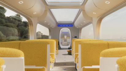 Rendering of the inside of a Starline high-speed train carriage showing soft yellow upholstered seating and lots of light coming from rounded windows and skylights