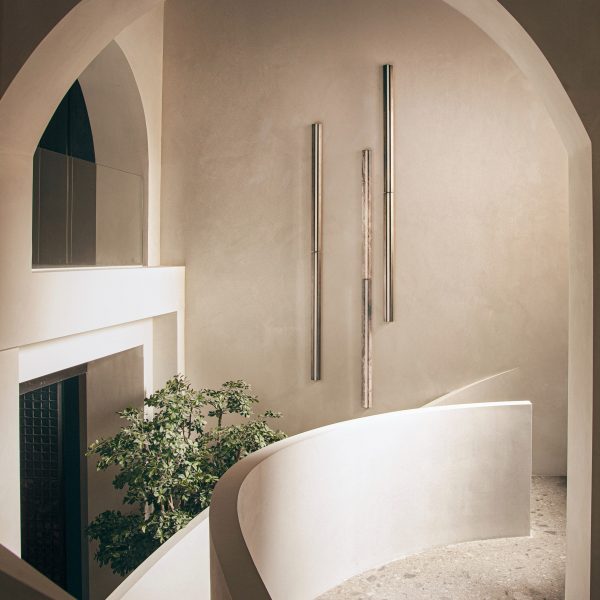 Photo of staircase with plant and lighting feature