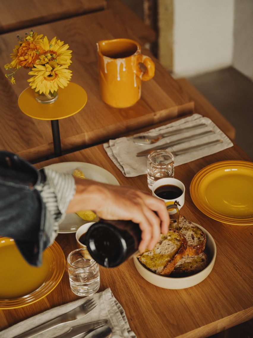 Close up photograph of the table spread, showing yellow crockery that has been incorporated into the scheme.