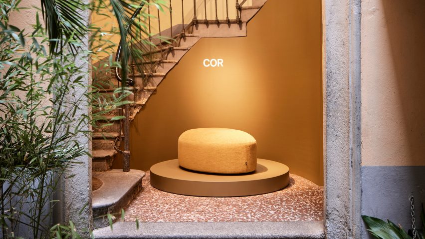 Photo of staircase and seat with Cor logo
