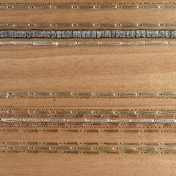 wood block with metal thread design