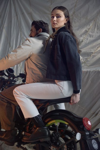 Models riding the flying flea motocycle