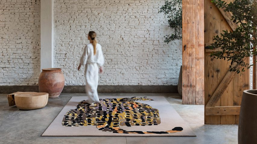 Photo of person walking on rug
