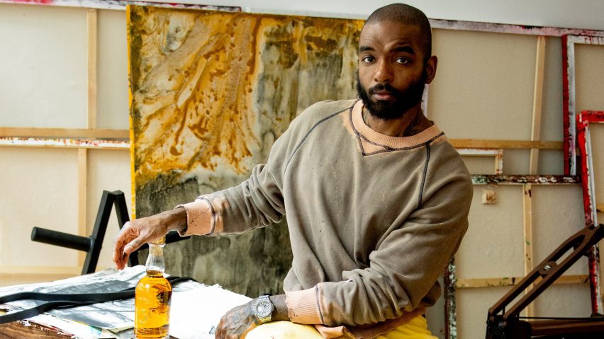 Photo of Samuel Ross in a studio with a bottle of The Balvenie whisky