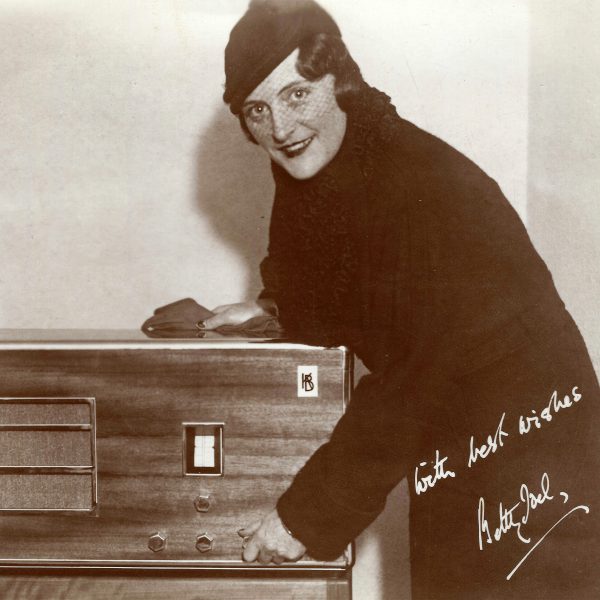 Betty Joel posing with the Kolster Brandes KB666 radio, 1933