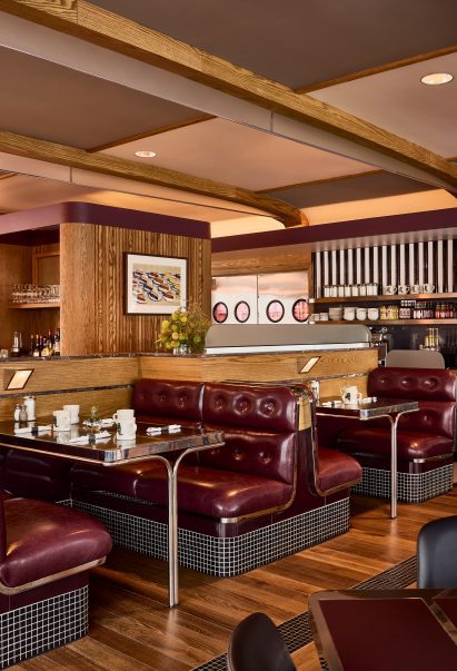 Custom booth seats upholstered in burgundy vinyl