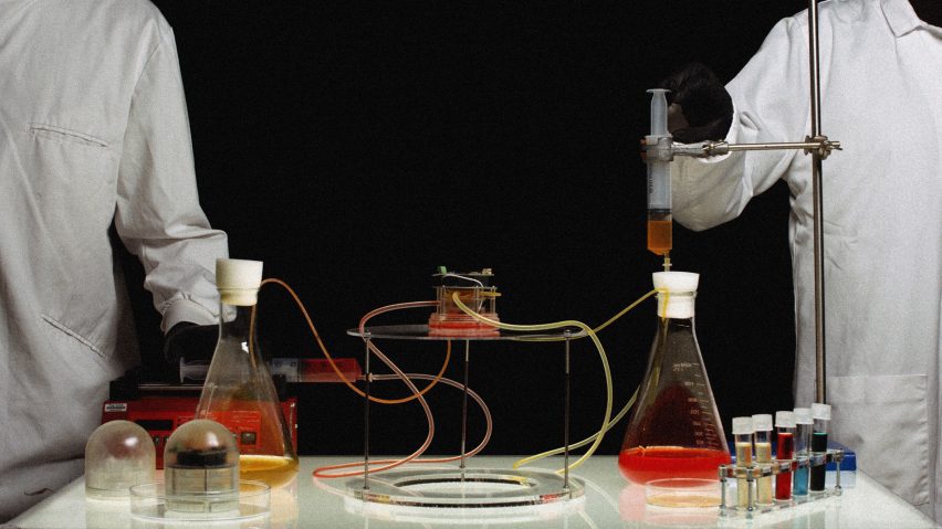 people in lab coats working