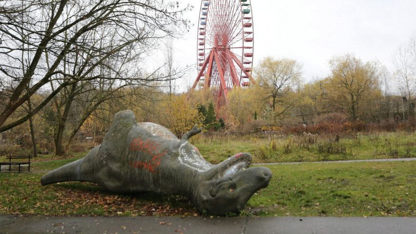 Fallen dinosaur statue