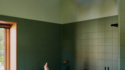 Architecture studio Familien Kvistad used muted green tones for this bathroom