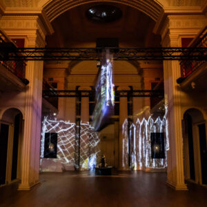 Exhibition in old building with projected elements