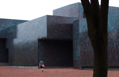 Tiled exterior of Huanglong Mountain Zisha Mineral Source Museum by Atelier XÜK