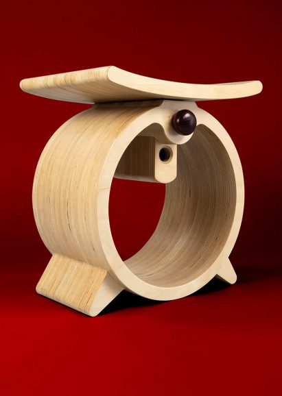 Wooden stool on red background