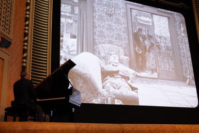 Piano by a cinema screen