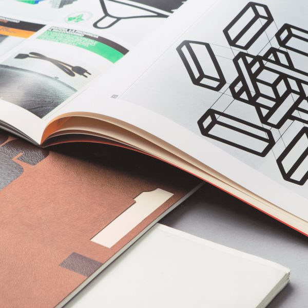 An open text book showing graphic design illustration