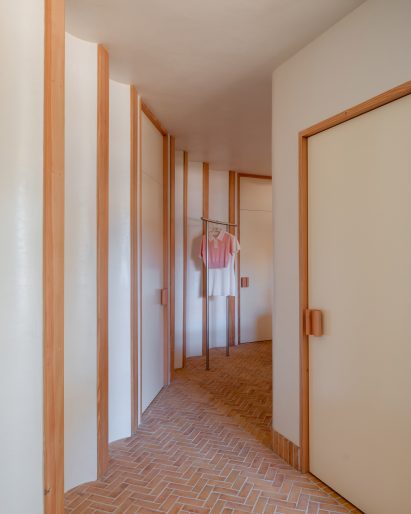 Scalloped plaster walls trimmed with Douglas fir