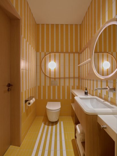 Yellow tile-clad bathroom