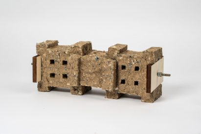 a rectangular brown object showcasing research of paludi-fibre and cotton fabric