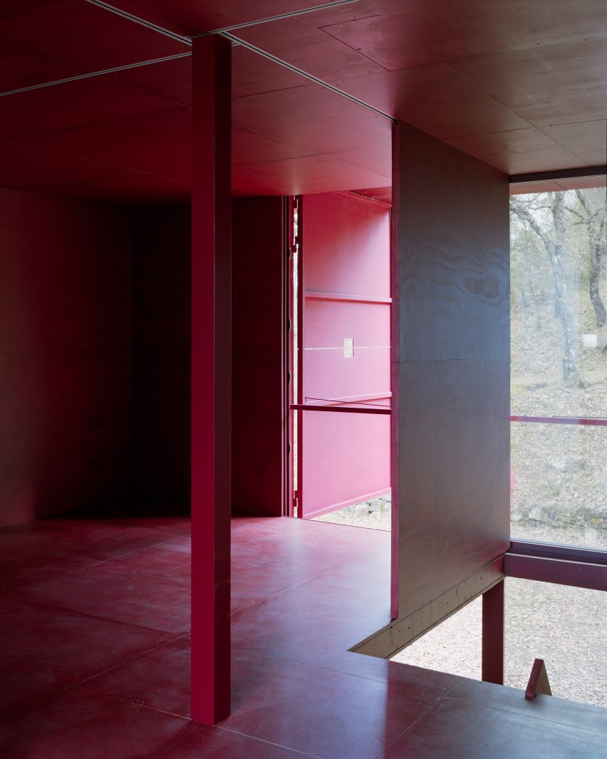 Interior of a red cabin by Test and Prefab House Changeover