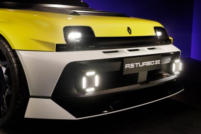 Headlights of yellow electric sportscar